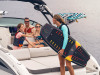 Woman aboard an SDX 270 Surf with her family preparing to go wakesurfing